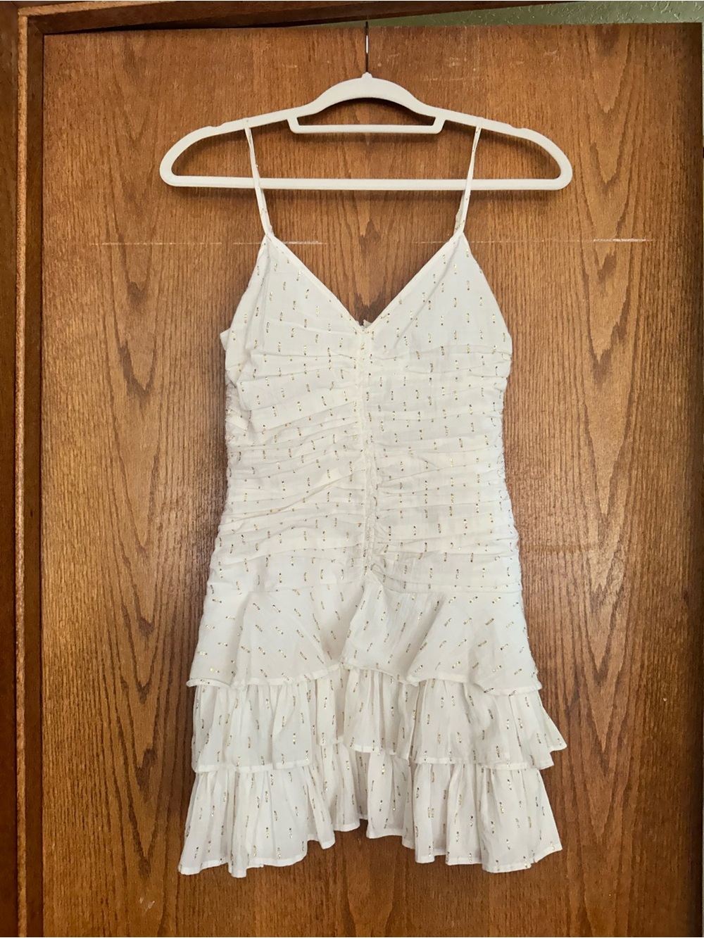 White Spaghetti Strap Ruffled Mini Dress with Gold Dot Accent